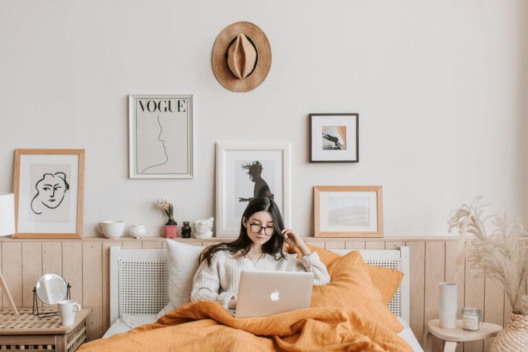 laptop girl living room sofa wall art hat coffee